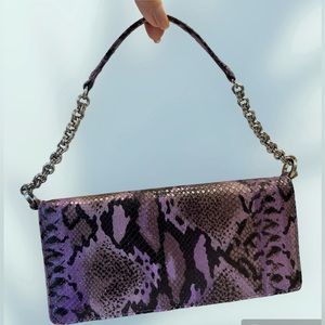 Purple snakeskin purse with short shoulder strap, chain detail. Magnet closure.